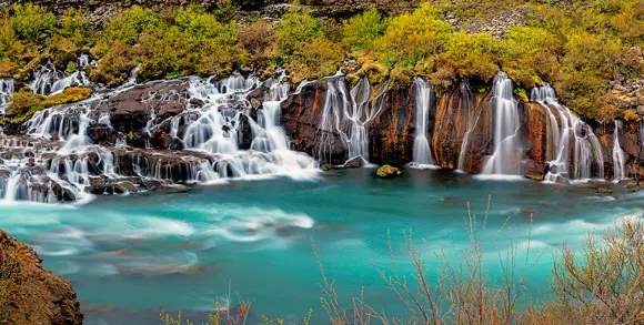 Panoramic view of the Hraunfossar Waterfall in Iceland.