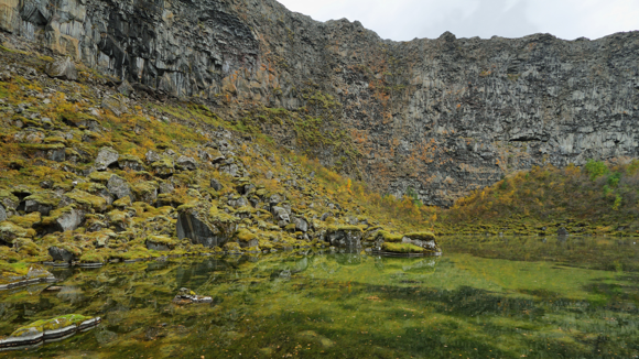 Views of the steep cliffs surrounding the Botnstjörn Lake at Ásbyrgi Canyon