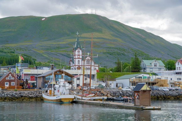 The harbour and church in Húsavík, Iceland.