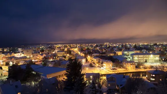 Aerial view of Reykjavík during Christmas with lots of lights.