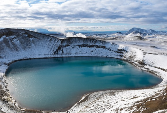 Still, blue water in a volcanic crater, Myvatn, Iceland
