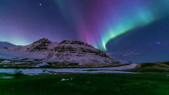 Northern Lights seen above Kirkjufell Mountain in Iceland.