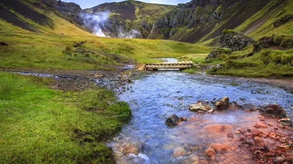 Reykjadalur Valley in Iceland with geothermal rivers.