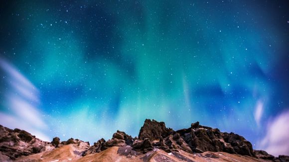 The colourful Northern Lights across the sky in Iceland.