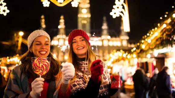 Girls having fun at a Christmas market.