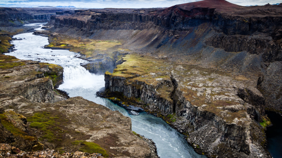 Hafragilsfoss waterfall in the colourful surroundings of Jökulsárgljúfur Canyon.