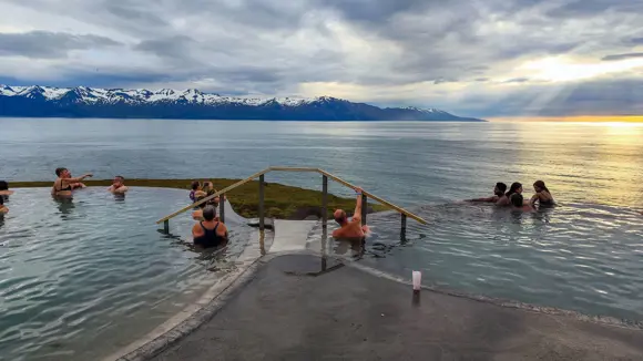 People enjoying the Geothermal Pool in Húsavík.