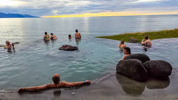 People relaxing in the warm waters of GeoSea in Húsavík.