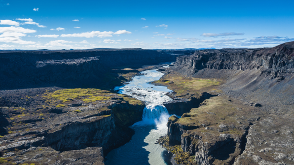 Hafragilsfoss waterfall with a view upstream of the Jökulsá á Fjöllum River.