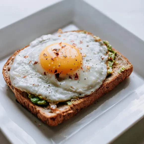 Egg on avocado toast in a breakfast restaurant.