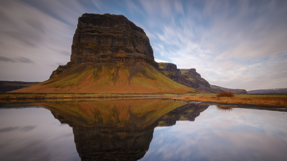 The reflection of Lómagnúpur mountain on the water in a lake